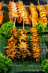 Grilled squid.Grilled squid street foods in Thailand.