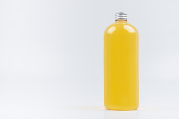 Transparent plastic tall bottle with orange drink, cooking oil or cosmetic produce, silver cap mockup on white background. Template for portfolio, design, branding identity.
