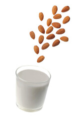 Glass of almonds milk and falling almonds nuts on white backgrounds.