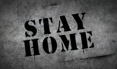 Stay home spray painted inscription on the concrete wall