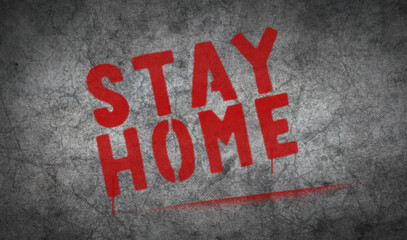 Stay home spray painted inscription on the concrete wall