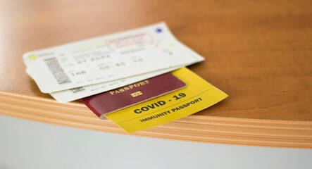 Coronavirus COVID-19 Vaccination proof booklet in passport. Travel ban health certificate Corona...
