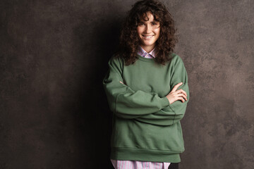 Happy beautiful curly girl smiling and looking at camera