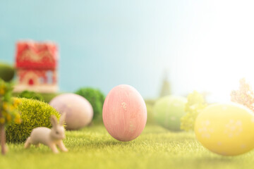 Easter egg outside in grass with evening sun from behind