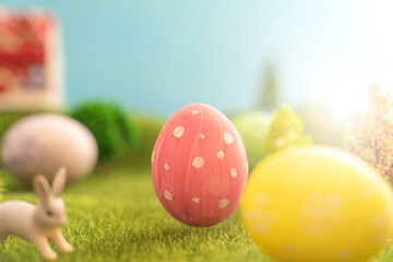 Easter egg outside in grass with evening sun from behind