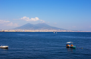 Beautiful view of Mount Vesuvius from the hill near embankment in Naples, Campania, southern Italy.