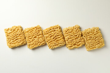 Flat lay with instant noodles on white background