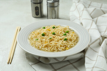 Concept of breakfast with plate of noodles on white textured background