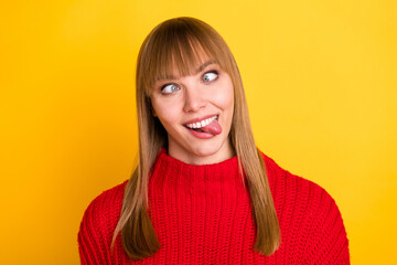Photo of blond nice optimistic lady tongue out crossed eyes wear red sweater isolated on bright yellow color background