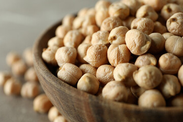 Wooden bowl with fresh chickpea, close up