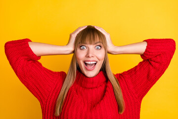 Photo of blond impressed lady hands head wear red sweater isolated on bright yellow color background