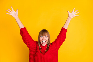 Photo of blond hooray lady hands up yell wear red sweater isolated on bright yellow color background