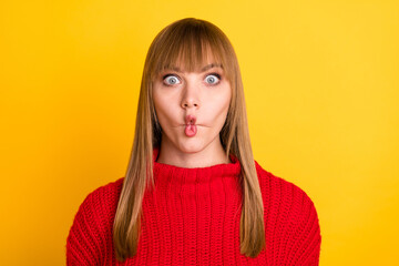 Photo of blond optimistic lady fooling wear red sweater isolated on bright yellow color background