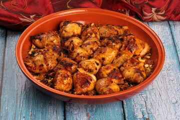 Traditional moroccan tajine of chicken with dried fruits and spices, top view. Moroccan chicken tajine with couscous
