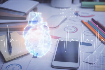 Double exposure of human heart drawing and cell phone background. Concept of medical education