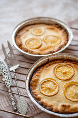 lemon cheesecake, fresh homemade cakes in a form on a light background