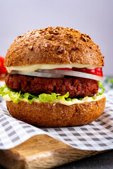 Tasty hamburger made with vegetarian plant based imitation minced meat burger and fresh vegetables