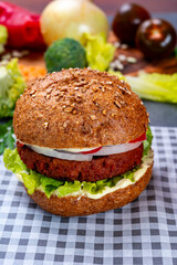 Tasty hamburger made with vegetarian plant based imitation minced meat burger and fresh vegetables