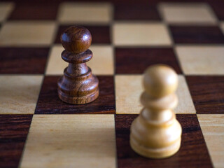 Wooden chess pawns close up with copy space