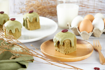 Green Tea Cube pound cake set on cafe table.