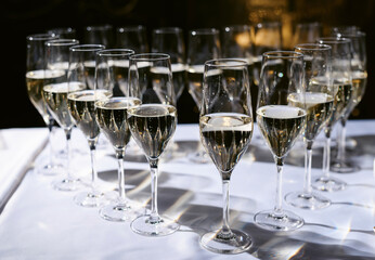 Set or row glasses of wine on the table before reception or wedding party