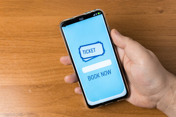Man using booking app on smartphone