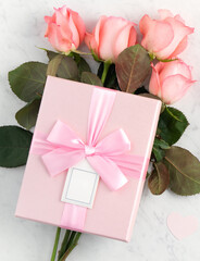 Giftbox and pink rose for Mother's Day holiday greeting design concept.