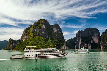 View of ships and islands in Halong Bay at sunset, Vietnam.