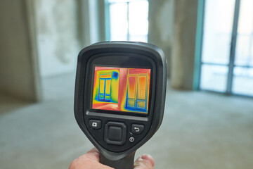 thermal imaging camera inspection of window building. check heat loss - 416495125