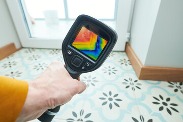 thermal imaging camera inspection of window building. check heat loss - 416495182