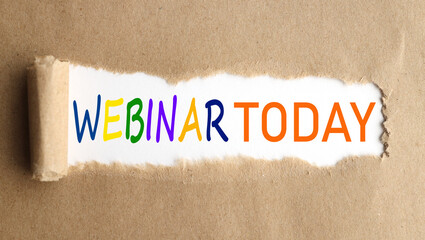 webinar today . text on white paper over torn paper background.