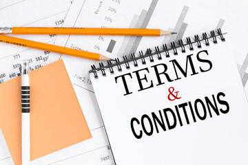 Terms & Conditions . text on white notepad paper on white background.