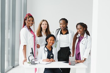 Fototapeta na wymiar African-American black doctor woman and medical group