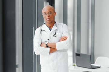 African American man male hospital doctor in white coat with stethoscope