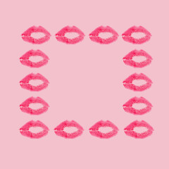 Creative frame made with red kisses on pastel pink background. Retro style aesthetic. 80s, 90s Romantic aesthetic concept with kiss print and lipstick. Makeup idea. Valentines day idea.