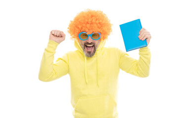 Happy funky man hold school book celebrating academic achievements, passed examination