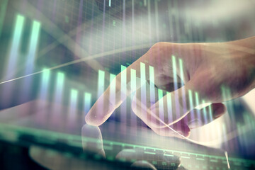 Multi exposure of man's hands holding and using a digital phone and forex graph drawing. Financial market concept.