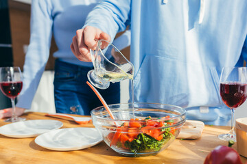 Close-up photo, hands cut vegetables into salad