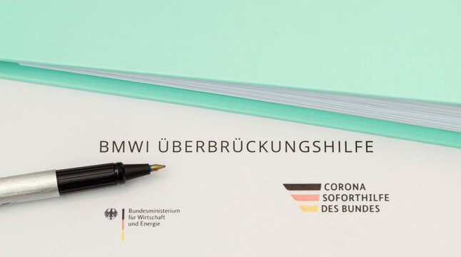 Mainz, Germany - February, 2021: BMWI Überbrückungshilfe, close-up of a German application form allowance for Corona bridging aid - Soforthilfe Corona. Emergency Aid Application corona pandemic