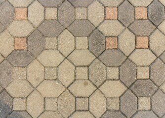 Interlocking paving with gray and white concrete blocks; Concrete products; Construction industry; Paved ground