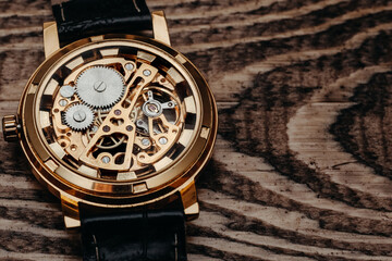 Mechanism, clockwork of a watch with jewels, close-up. Vintage luxury background. Time, work...