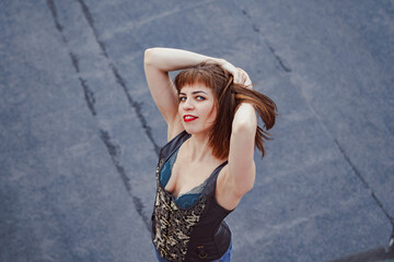beautiful girl standing on the roof of the house