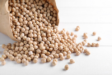 Chickpeas on white table, space for text