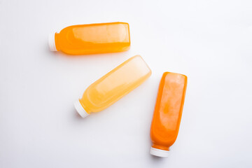 Top view photo of different detox juice bottles, antioxidant and daily vitamins you need.