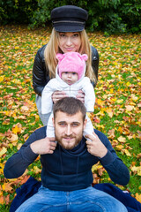 father and child in autumn park