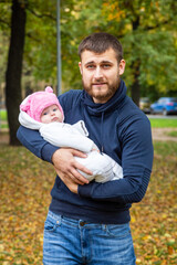Naklejka na ściany i meble father and child in autumn park
