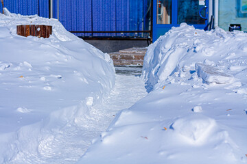 Snow-covered roads and sidewalks in the city center. Snow removal. Soft Focus