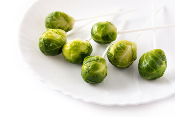 Set of brussel sprouts with lollipop sticks isolated on white background