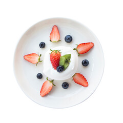 Top view Close-up, Japanese-style pancake topped with mixed fruits, strawberries, kiwi, and blueberries on the top of a cake placed isolated on white background.