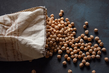 Bag of chickpeas on a dark table